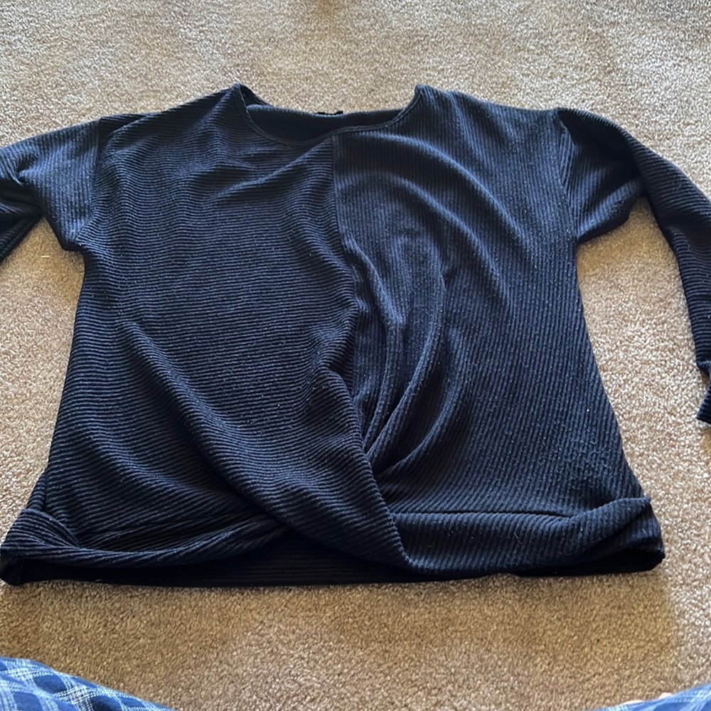 Navy blue sweater with not at the bottom